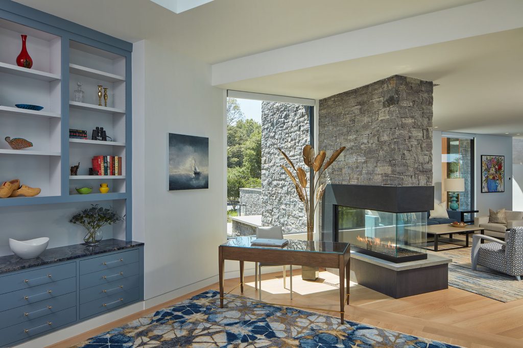 The same granite stonework on the exterior is also used around the fireplace.