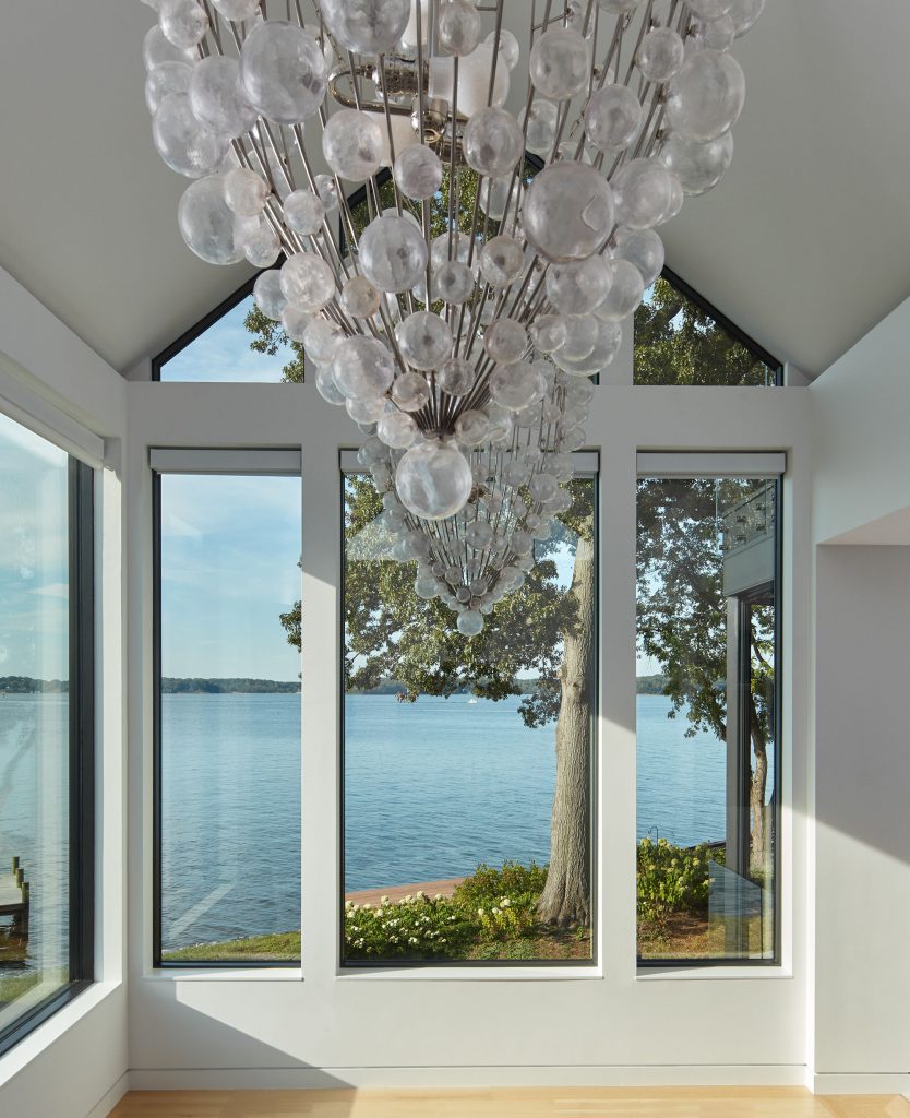 A Lolli chandelier by Oly Studio  hangs in the dining room.