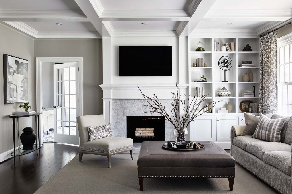 The new ceiling coffers tie into the resurfaced fireplace, adding a much-needed architectural detail.