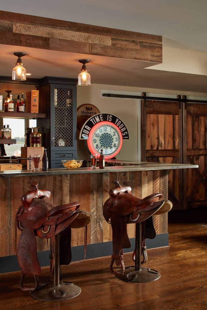 Inventive swiveling saddle-topped barstools await the thirsty rider at this custom bar.