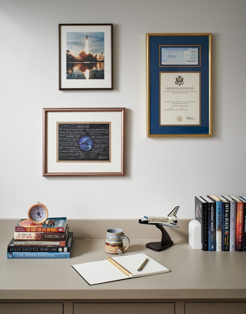 Memorabilia from Ken’s career as an astronaut decorate the built-in desk in the home office.