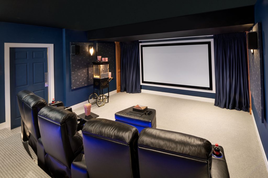 Butler has Zoom meetings in a fully equipped home theatre on the home’s lower level, with a giant movie screen with retractable drapes and adjustable seats. 