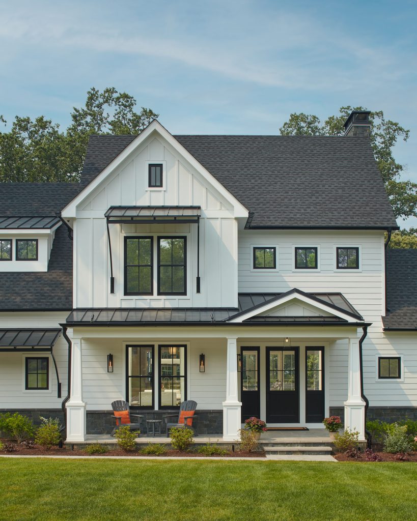 Homeowner Jeffrey Dawson pored over more than 900 architectural plans before selecting the “modern farmhouse,” defined in this case by vertical and horizontal board and batten siding, black window frames, and pitched rooflines.