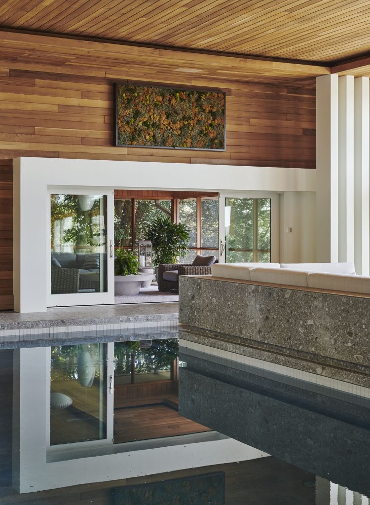 Interior designer Patrick Sutton designed a banquette that juts right up to the pool and is made of the same material as the flooring.