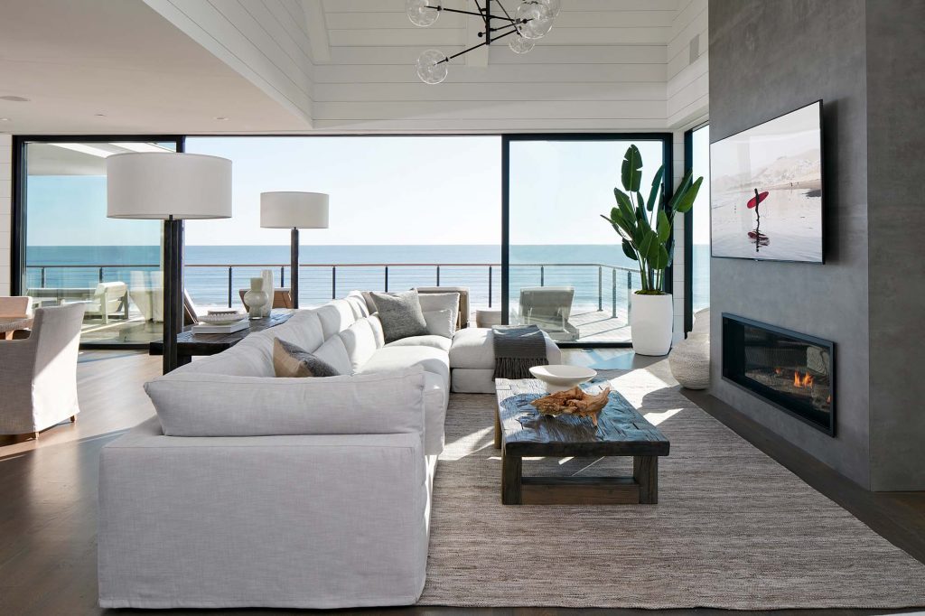 Surfside’s open floor plan is broken up into separate living spaces by lighting and furniture arrangements.