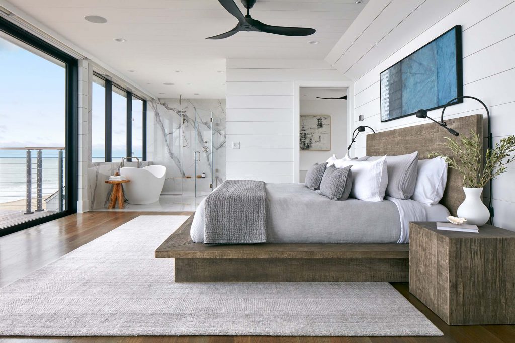 Unfinished wood and lots of white give  the interior design an airy, beachy feel.