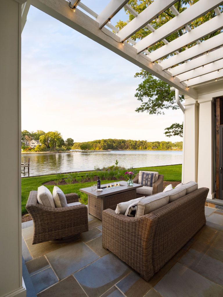 The back of the house leads out to a patio set up for outdoor entertaining.